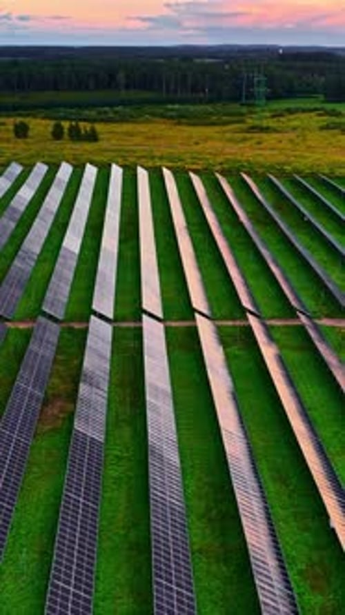 Aerial View of Solar Panel Field at Sunset