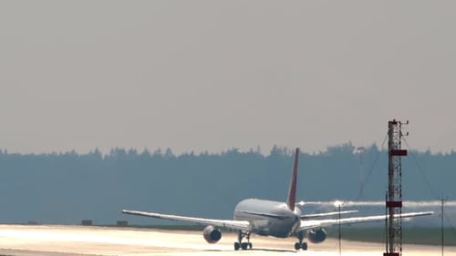 Airplane Moving on Runway at Airport on Sunny Day