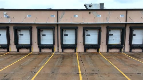 Industrial loading dock at a warehouse. Aerial truck shot of empty cargo center.