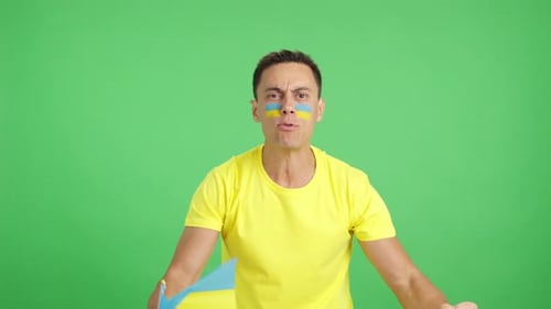 Man Celebrates With Flag on Green Screen