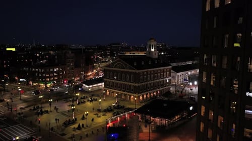 Aerial approaching shot of Faneuil Hall Marketplace in Boston City with walking people in square. Wa