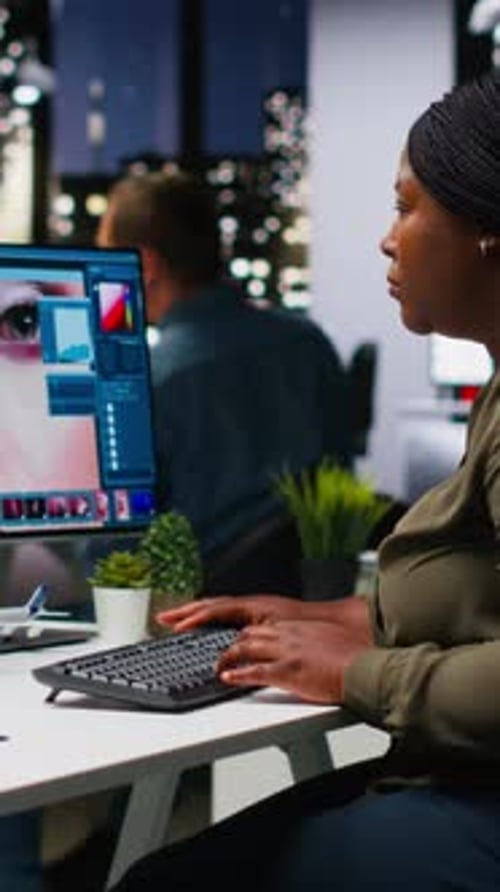 Woman Working Late at Office on Computer
