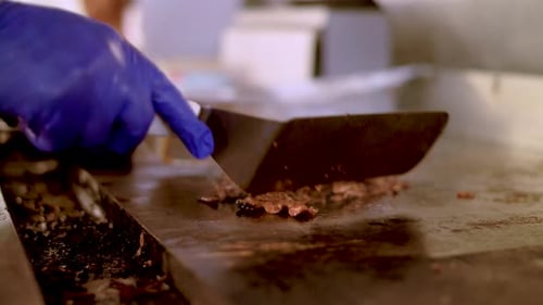 Meat cooks on the grill