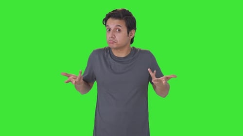Confused Indian man asking what question Green screen