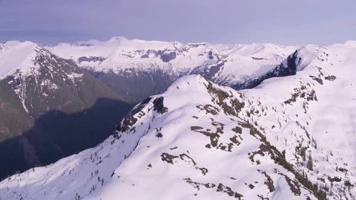 British Columbia, Canada Circa-2018. Aerial View of Snow Covered Mountain Range