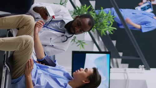 Doctor Checks Patient's Blood Pressure in Hospital