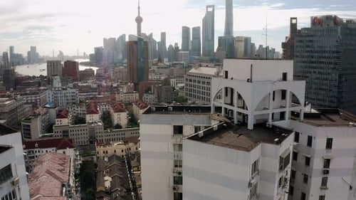 Beautiful Shanghai city skyline reveal from downtown suburb, aerial view