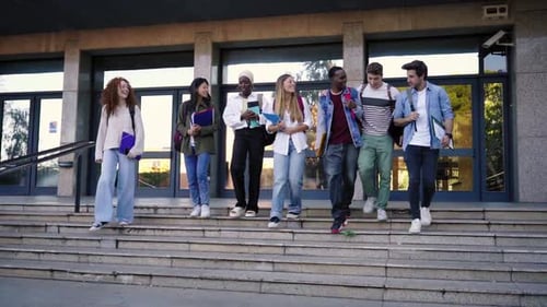 Multicultural Group of Students Walking Going Out of University Leaving to Go Home