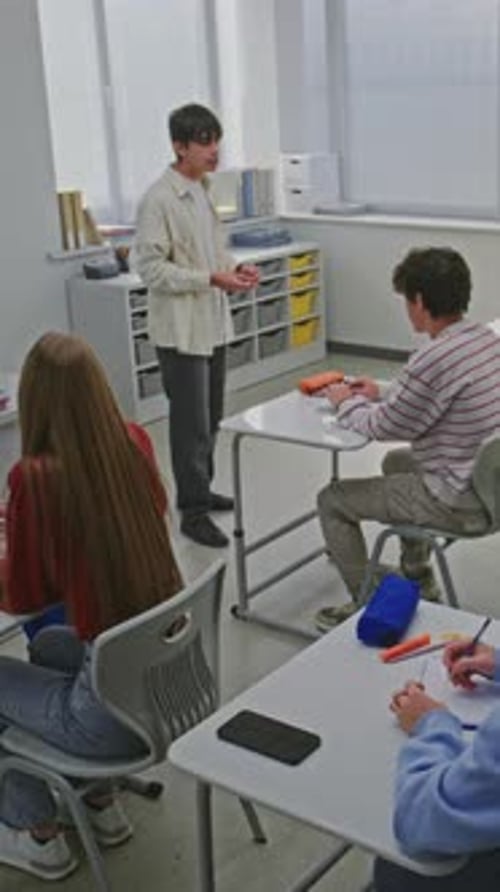 Students and Teacher Listen Attentively Presentation By One of Students