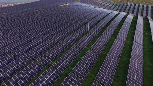 Aerial View of Solar Panels on Rolling Hills