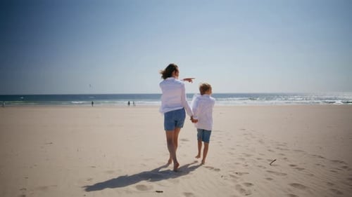 Happy Woman Walking Son on Beautiful Beach at Summer Sun Relaxed Mother Child