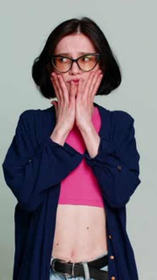 Confused Woman Shrugging Shoulders with a Puzzled Expression