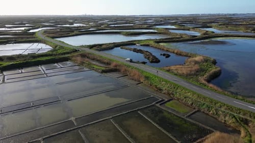 Salt Marshes Near the Small Old Town of Guerande France Cars on the Road