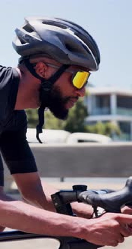 Workout, man and cycling on bike in city for cardio exercise, endurance challenge and pace training