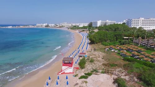 Aerial View of Ayia Napa Beach with Sunbeds and Turquoise Waters