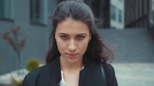 Portrait of Beautiful Calm Brunette Young Woman Caucasian Girl Standing Outside in Business District