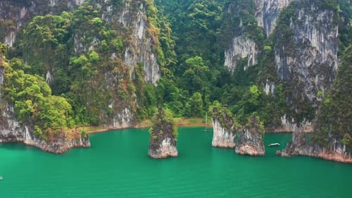 Three limestone rocks Three Brothers at Cheow Lan Lake, Khao Sok National Park, Surat Thani Province