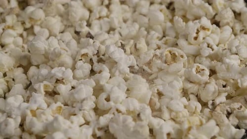 Sprinkling Salt on Popcorn Slow Motion Macro Shot