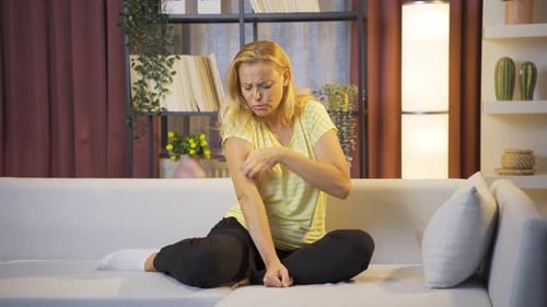 Woman with itchy arms.