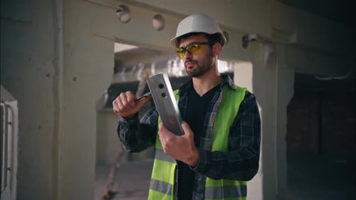 Tired Pensive Caucasian Man Repairing Metal Iron Piece Using Spanner Tool in Construction Builder