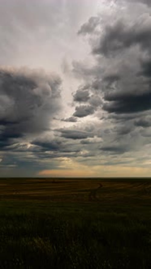Stormy Clouds Over Tranquil Farm Field