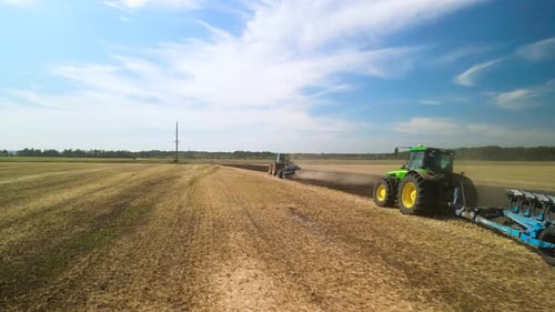 Tractors plowing the field in Ukraine