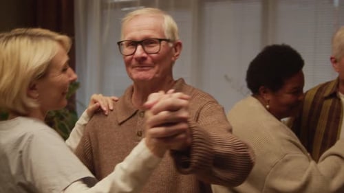 Active Multiethnic Seniors Enjoying Dancing Activity in Nursing Home