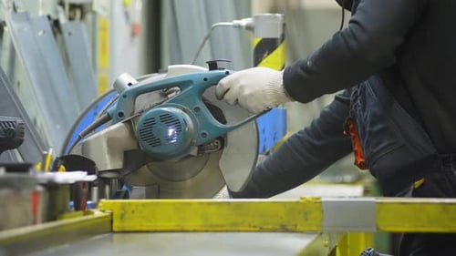 Man Using Chop Saw to Cut Metal