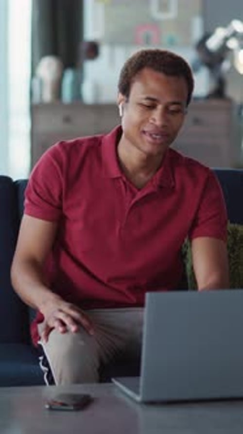 Man Chatting on Laptop During Video Conference