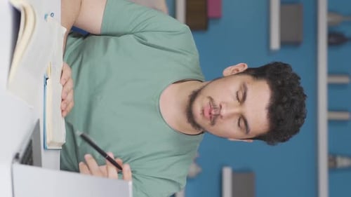 Vertical video of Crying male student unhappy.