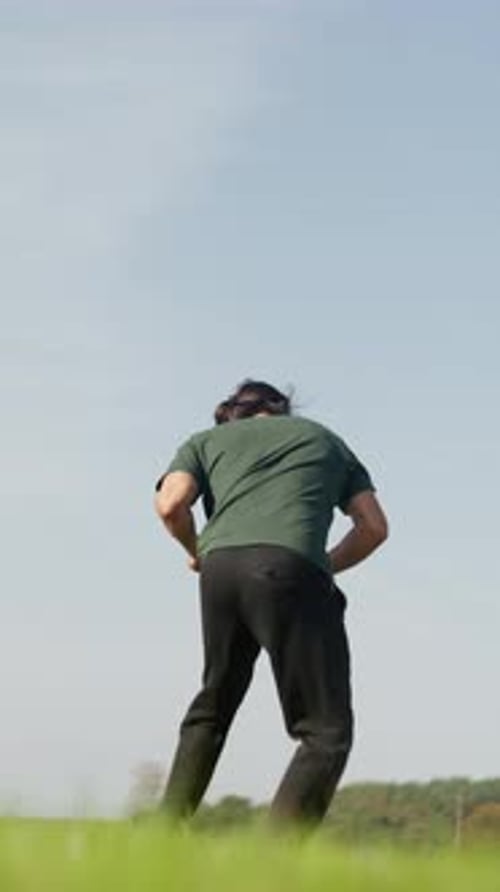 Man Practicing Martial Arts Outdoors