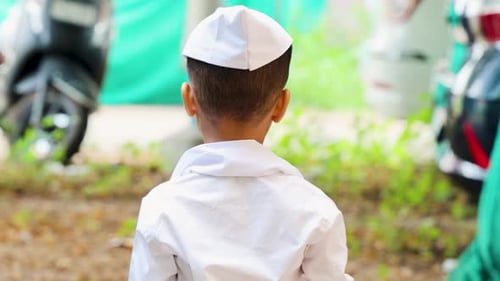 young kid back view with wearing ethnic marathi traditional cap