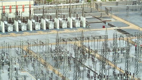 A high voltage power station from above by aerial view drone.