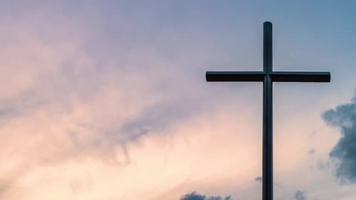 Silhouette of Cross with a Colorful Cloudy Sky