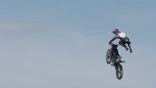 Motocross Rider Performing Aerial Stunt in the Sky