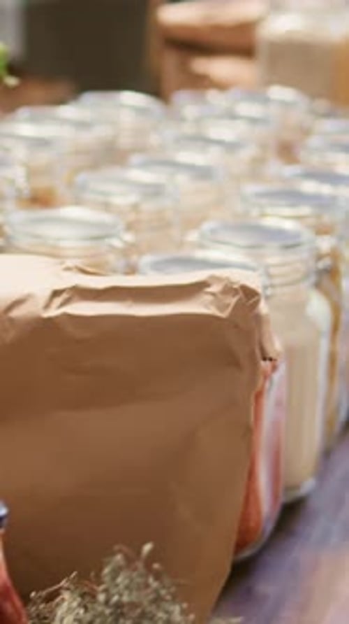 Vertical Video Close Up on Bulk Items in Glass Jars