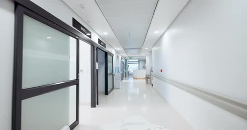 Hospital, empty hallway and gurney pov or medicare at clinic, medical and care in corridor