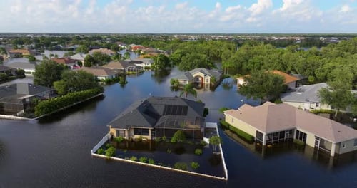 Flooded Houses From Hurricane Rainfall Water in Residential Community in Florida Aftermath of