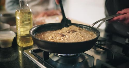 Cooking Food in Frying Pan Indoors