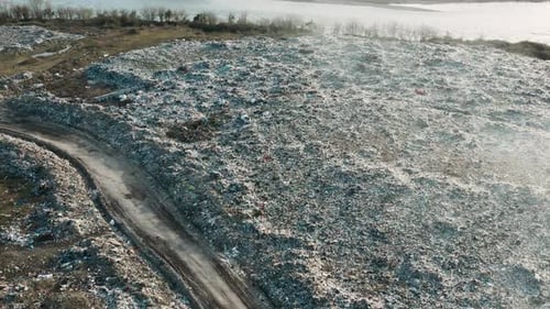 Aerial View of Garbage Pile in Trash Dump Dump Track Drives Trough Landfill Biohazard for Ecosystem
