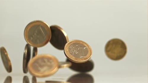Falling Euro Coins on the Surface Filmed is Slow Motion 1000 Fps