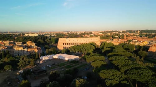Aerial Boom Shot Reveals Roman Colosseum at Sunrise. Rome, Italy