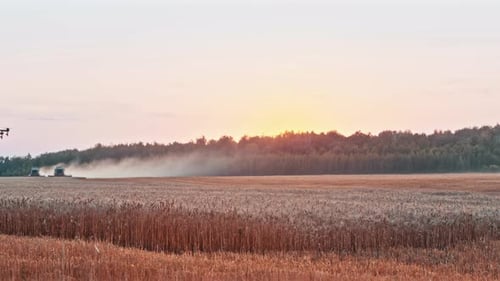 Drone Blowing Mist Over A Field