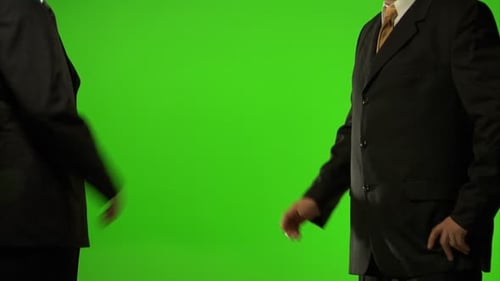 Businessmen Shaking Hands on Green Screen Agreement