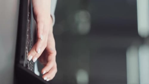 Woman Typing on Laptop Keyboard Close-Up
