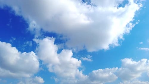 Clouds Moving Slowly Across a Blue Sky