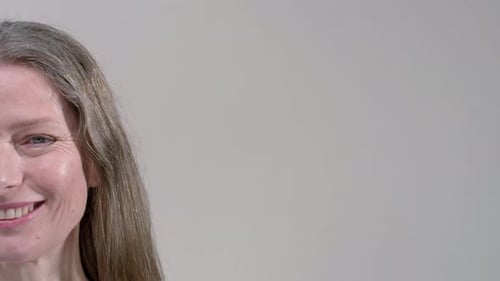 Half Portrait of an Old Woman Senior Female is Smiling Mature Lady Concept of Natural Beauty