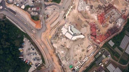 drove view of a construction ground with site cranes in a urban area