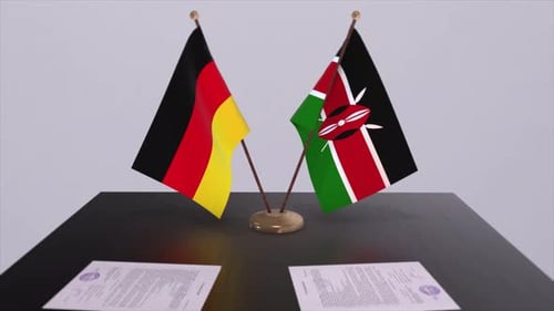 Germany and Kenya Flags on Table with Documents