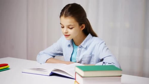 Young Girl Studying and Reading a Large Book